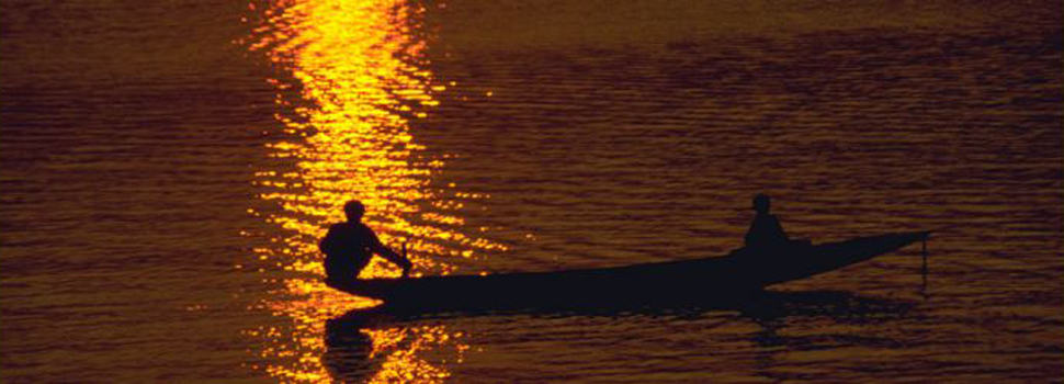 Boatman at sunset in Hue Vietnam